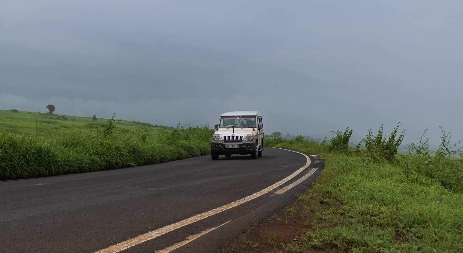 Representative SUV travelling through green countryside